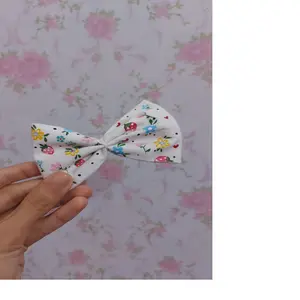 custom made hand painted bows made in cotton/ linen fabrics with strawberry print for resale by hair accessories supply stores