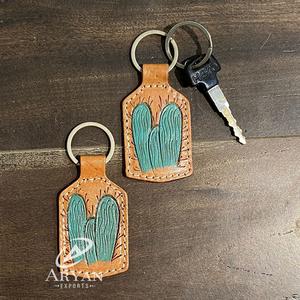 ห่วงโซ่กุญแจหนังที่แกะสลักด้วยมือรูปทรงแปลกใหม่น่ารักอุปกรณ์เสริมพวงกุญแจหนังสำหรับทุกเพศ - Product Image 1