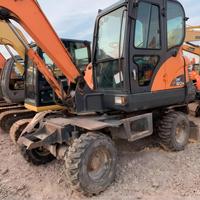 Prix Abordable – Modèle 2022 – Excavatrice sur Pneus d'Occasion Doosan DX60W 6 Tonnes – Matériel de Terrassement d'Occasion – Moteur Yanmar – Godet de 0,23 m³