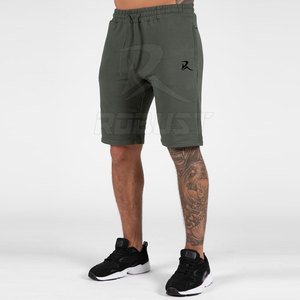 2024 hommes Shorts de gymnastique personnalisé haute rue Style solide motif non tissé tissage décontracté et à la mode entraînement vêtements de course - Product Image 1