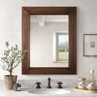 Cadre de miroir mural en bois de style vintage pour une décoration intérieure classique, avec des détails sculptés à la main et une teinte bois naturelle chaleureuse.