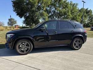 SUV USADO DE ULTRA LUJO 2024 C-200 299HP 4.0L TRANSMISIÓN AUTOMÁTICA DE 9 VELOCIDADES NEUMÁTICOS R18 IZQUIERDO INTERIOR DE TELA COLOR ELÉCTRICO OSCURO COPILOT 7 PLAZAS - Product Image 2