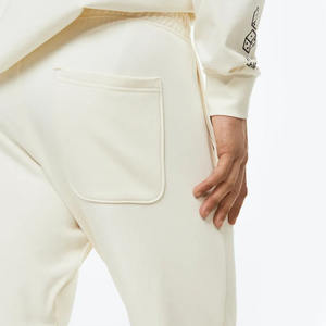 กางเกงวอร์มสำหรับวิ่งจ๊อกกิ้งรุ่นพื้นฐานสีเบจสำหรับผู้ชายมีสไตล์พิมพ์ลายหน้าจอออกแบบได้ตามต้องการและเอวยางยืด - Product Image 3