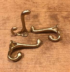 Polished brass <b>wall</b> hooks <b>for</b> luxury interiors adding warmth and functionality to <b>walls</b> spaces rooms homes offices - Product Image 1