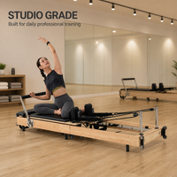 Machine de Pilates Reformer en bois de chêne avec barre de repose-pieds réglable et coussin en PU, portable pour la maison et le studio de fitness