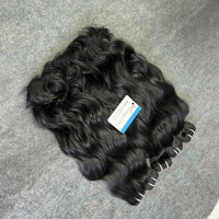 Top couleur jetblack extension de cheveux humains vietnamiens texture ondulée naturelle prête à expédier cheveux trame machine