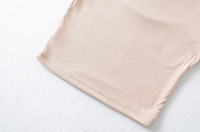 T-shirt tricoté à manches courtes pour femme, nouveau modèle asymétrique avec épaulettes, décoration sans bretelles, design plissé, style doux