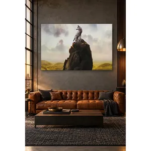 Fida Wolf contemplant l'horizon sur un sommet rocailleux, impression sur toile - Product Image 1