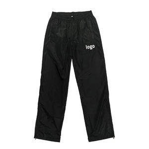 Pantalon et pantalon coupe-vent unisexe OEM logo personnalisé unisexe solide blanc homme décontracté bouton latéral évasé nylon piste polyester - Product Image 5