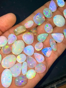 โอปอลไฟเอธิโอเปียแท้ทรงหลังเบี้ยสีขาว  โอปอลแท้รับรองคุณภาพ 5-8 กะรัต สำหรับทำเครื่องประดับ Mehradjuddin Gems - Product Image 5