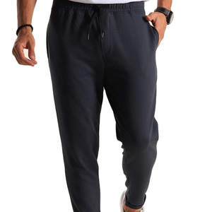 Pantalones de hombre de otoño cálidos y ligeros, acampanados, tallas grandes, casuales, deportivos, de cintura media, de algodón, de ajuste holgado, con cordón y bolsillos. - Product Image 1