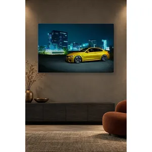 Impression sur toile de la BMW M4 jaune Fida dans les lumières de la ville nocturne - Product Image 4