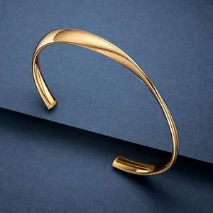 Acabado dorado China Escultura moderna Brazaletes de metal con toque tradicional - Product Image 4