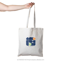 Exportbereite, hochwertige, beige Bio-Baumwoll-Tragetasche im nachhaltigen Design mit individuellem Logo, Seilgriffen und mittlerer Größe für den Einkauf.