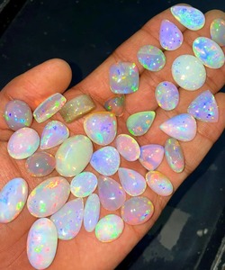 โอปอลไฟเอธิโอเปียแท้ทรงหลังเบี้ยสีขาว  โอปอลแท้รับรองคุณภาพ 5-8 กะรัต สำหรับทำเครื่องประดับ Mehradjuddin Gems - Product Image 4