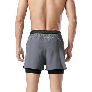 Pantalones cortos deportivos de doble capa OEM para hombre, nuevo diseño, estilo callejero, patrón sólido, poliéster, hechos al mejor precio - Product Image 3