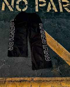 Ropa de calle personalizada de alta calidad, pantalones de chándal acampanados de nailon, pantalones de chándal informales holgados con estampado lateral para hombre, pantalones cortavientos - Product Image 3