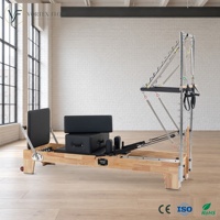 Machine de Pilates Reformer 2-en-1 haut de gamme avec cadre en bois de chêne, réglable, pour le renforcement musculaire, et demi-tourneuse pour studio professionnel