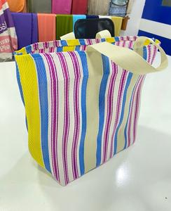 Bolsos de mujer Cubo de dos correas de rayas multicolores ecológicos fabricados en la India compras impermeables tejidas de nailon reciclado - Product Image 1