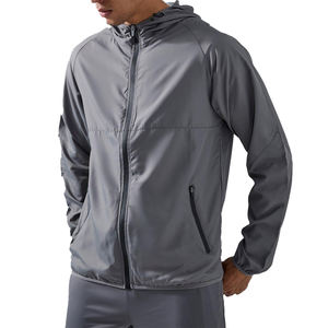 Taille personnalisée Veste coupe-vent imperméable à capuche manches raglan brodées pour l'hiver Logo à l'avant Service OEM Matériau polyester/nylon - Product Image 1