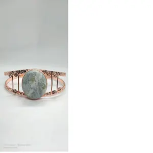 copper bangles and bracelets with large sized gemstone pendants suitable for use by fashion jewelry stores