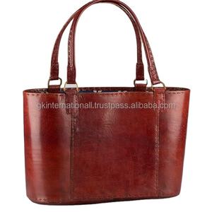 BOLSO DE CUERO HECHO A MANO DE LUJO CON FORRO DISTINTIVO EN COLOR TAN OSCURO - Product Image 1