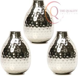 Vase de table en métal design avec finition haut de gamme et forme accrocheuse, idéal pour la décoration et un décor de luxe - Product Image 1