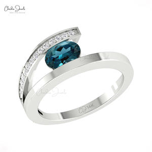 Bague à tige fendue en topaze bleue de Londres cloutée avec un diamant blanc de 0,10 ctw Bague en pierre précieuse ovale de 7x5mm en or pur 14 carats Expédition express - Product Image 3