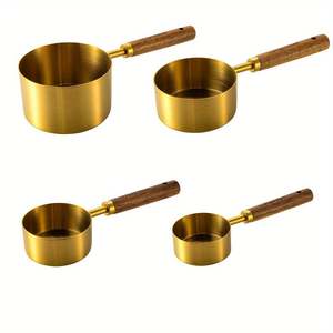 Juego de cucharas medidoras pulidas en oro mate de calidad superior en latón macizo con mango de madera perfecto para utensilios de cocina elegantes - Product Image 1