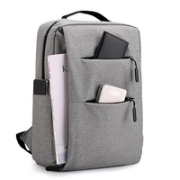 Vente chaude Grand sac à dos scolaire à la mode Poches multi-fermeture éclair Personnalisé Gris Teint Sac d'ordinateur portable Panneau solaire Antivol Polyester