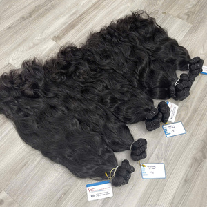 Vente en gros d'extensions de cheveux humains vierges bruts non transformés vietnamiens paquets de double trame à cuticules alignées de style ondulé naturel - Product Image 2