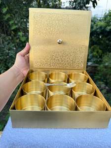 Antique finished pure brass masala box with multiple sections for storing masalas in a decorative kitchen setting - Product Image 6