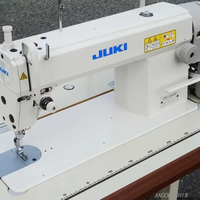 Machine à coudre industrielle à point droit simple aiguille JUKI DDL-5550N d'occasion pour vêtements