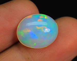 อัญมณีทรงหลังเบี้ยรูปไข่โอปอลเอธิโอเปีย-อัญมณีไฟหลายแบบ-อัญมณีขัดแบบเรียบจากเหมืองเอธิโอเปีย - Product Image 3