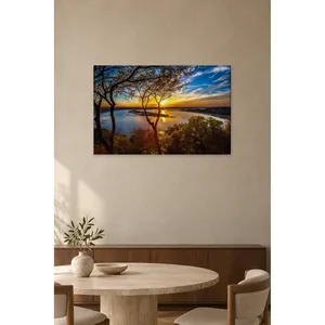 Impresión en lienzo de Fida: Atardecer a través de árboles sobre un lago - Product Image 3