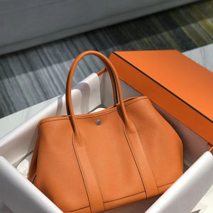 2025ใหม่กระเป๋าถือตะกร้าผักลายลิ้นจี่หนังเย็บด้วยมือกระเป๋าผู้หญิงแฟชั่นสีส้ม - Product Image 1