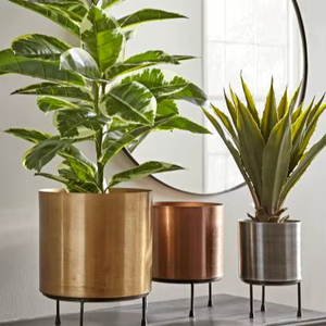 Decorative metal planter stand included for raising plants ground level creating attractive displays in both home and garden - Product Image 1