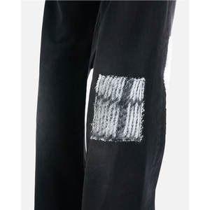 กางเกงยีนส์เย็บปะติดมีสไตล์ที่ดูเครียดและใส่สบาย - Product Image 5