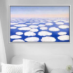 Obra de arte impresa en lienzo con nubes flotantes surrealistas en azul sereno, lienzo con marco blanco - Product Image 1