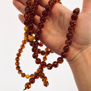 Mala bouddhiste en ambre naturel cognac doré, 108 perles - Product Image 1