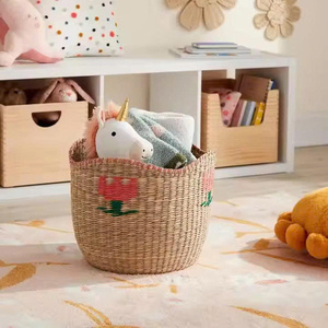 Best Selling High Quality Handwoven Woven Seagrass Kids Storage <b>Basket</b> with Pink Flower for Clothes <b>Toys</b> Home Decoration - Product Image 4