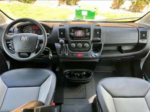 Camper Van Blanca Convertida con Detalles Negros y Ventanas Tintadas Estacionada en la Entrada + Envío de Carga Gratuito - Product Image 5