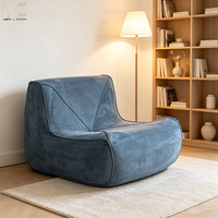 Sofá individual de lujo moderno tapizado en azul para sala de estar con otomana, ideal para venta al por mayor