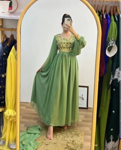 Robe maxi traditionnelle élégante et fluide de couleur vert pastel avec corsage orné de dorure et manches en tulle doux - Product Image 1