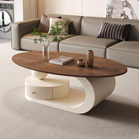 Table basse créative de style crème, ovale, pour salon, petite unité domestique, style italien minimaliste avec rangement