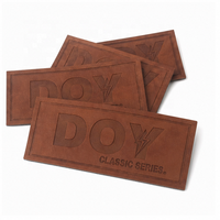 Étiquettes One Stop Patchs de réparation en cuir PU personnalisés avec logo en relief