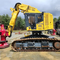 Tracteur forestier sur chenilles CATERPILLAR XT430-5 d'occasion de qualité avec pelle rétrocaveuse et chargeur frontal