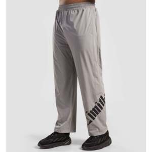 Pantalones Deportivos Color Gris Claro para Hombre, Estilo Formal a la Moda, Logotipo Personalizable, Lavado de Color, Cierre con Cremallera Elegante para Entrenamiento - Product Image 1
