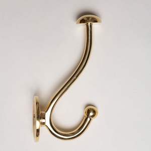 Premium finish brass wall hooks create organized look while enhancing wall surfaces in well designed home interiors - Product Image 3