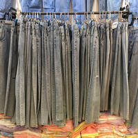Jeans en denim déchiré décontracté pour femme, taille haute extensible, couleur unie, avec boutons clairs et rivets foncés, imperméable, vente en gros sur mesure